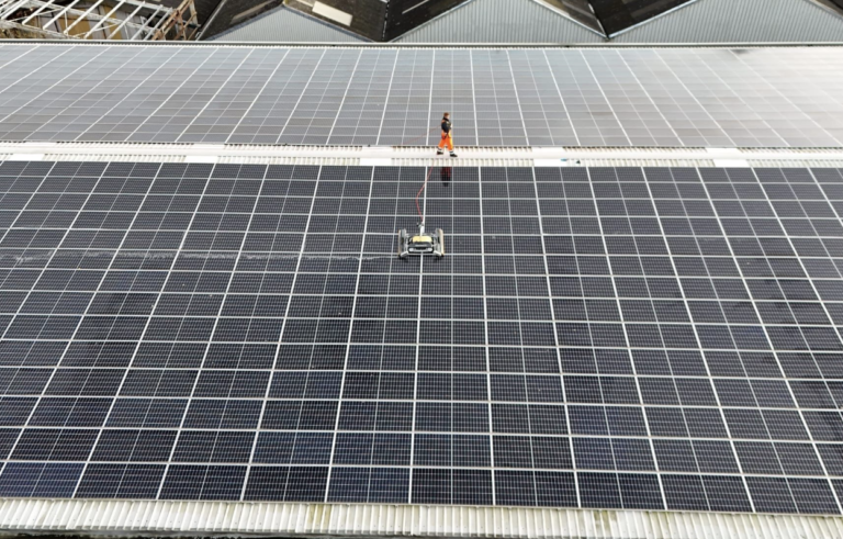 Solar Panel - Man working on large industrial solar panel